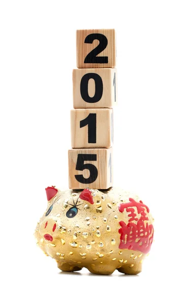Nieuwjaar 2015: piggy bank en bouwstenen — Stockfoto