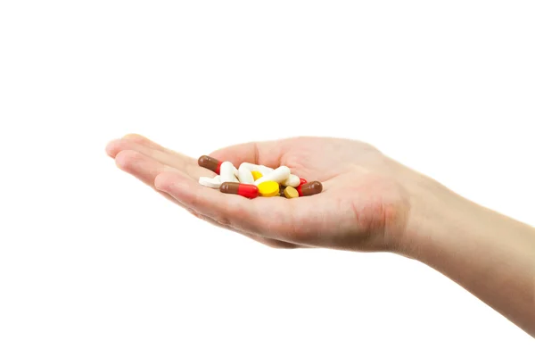 Diferentes pílulas deitadas na mão — Fotografia de Stock