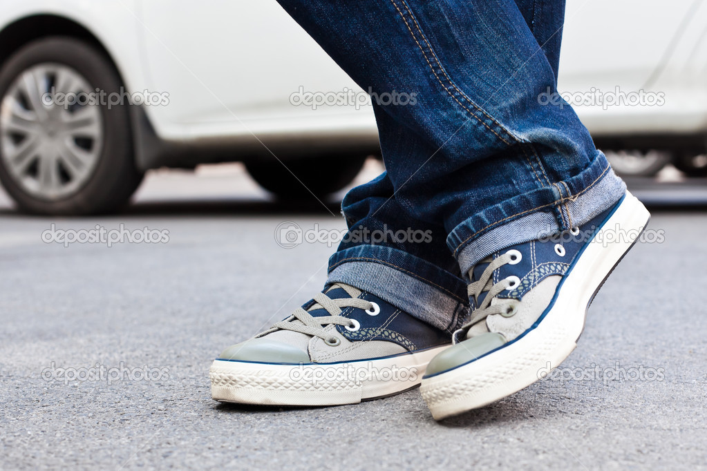 Feet shod in sneakers — Stock Photo © Furtseff 36281171