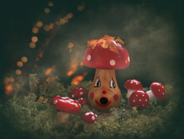 Composition with figurines of mushrooms in a fantastic magical forest.
