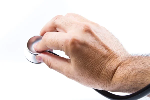Stethoscope and hand — Stock Photo, Image
