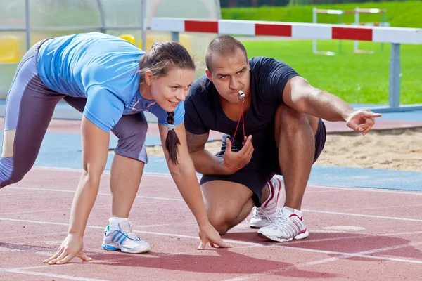 Man and woman at the stadium — Stock Photo, Image