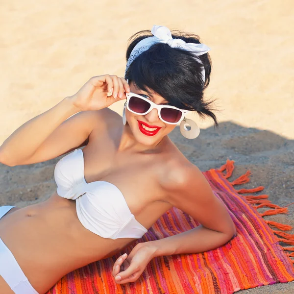 A beautiful young girl in retro look with red lips in a white sw — Stock Photo, Image