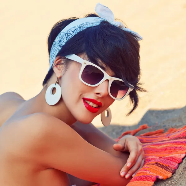 A beautiful young girl in retro look with red lips in a white sw — Stock Photo, Image