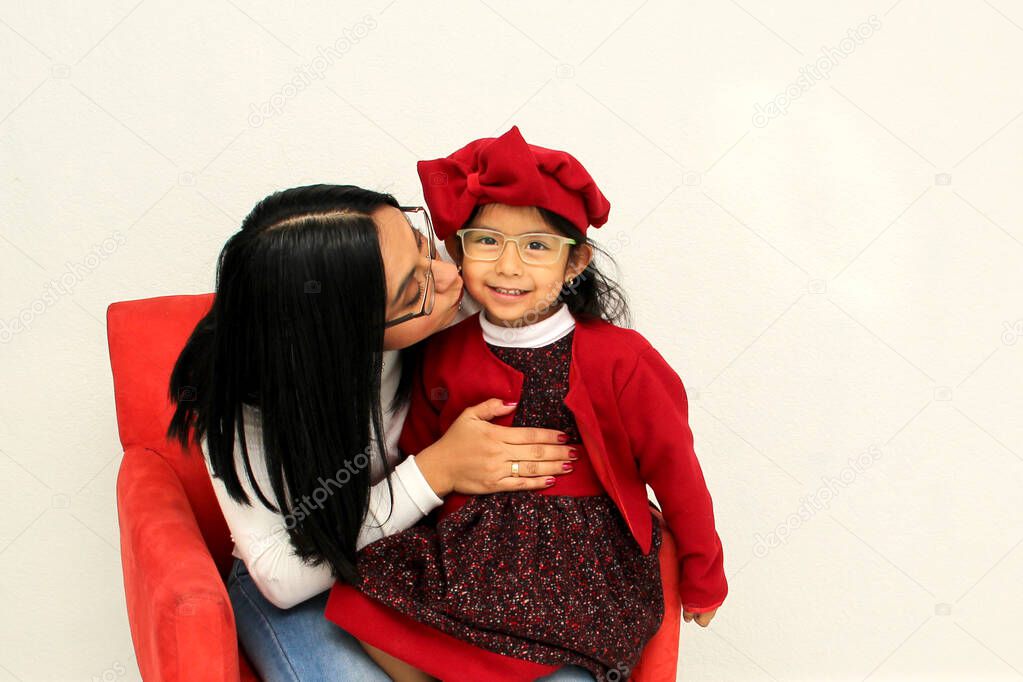 Latin mom and daughter show their family love very happy, elegant and casual, ready to celebrate the holidays like Christmas, New Years, Thnaksgiving, Love Day, Mother's Day
