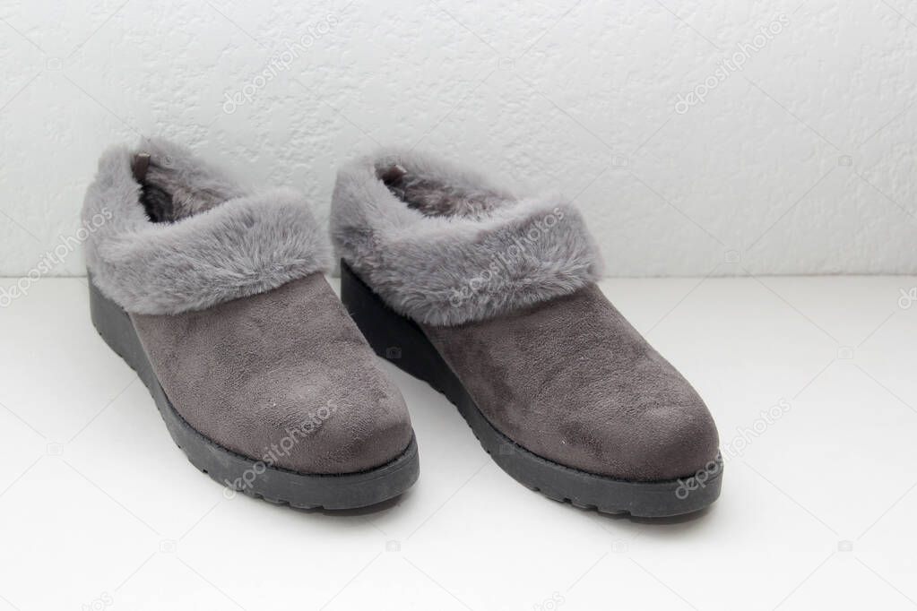 Gray comfortable slipper-type shoes padded inside for greater comfort are non-slip, soft to wear at home to rest