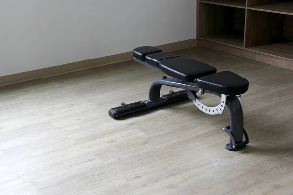 Short weight bench to exercise in gym alone on wooden floor for healthy life and start a better lifestyle