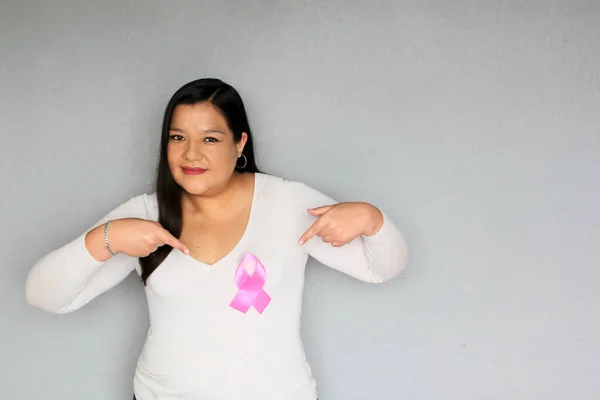 Latin Woman Pink Ribbon Hands Plain Gray Background Campaign Breast — Foto Stock