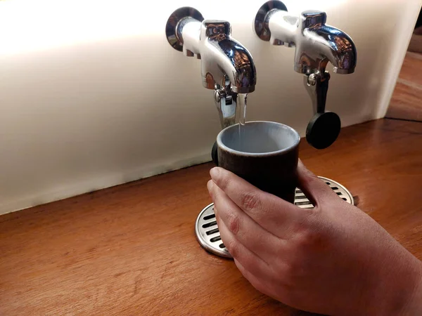 Hot water dispenser for brewing tea in a glass on a Japanese-style dining bar