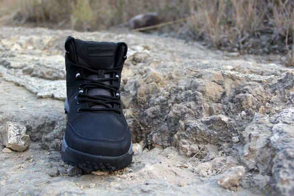 Hiking boots in the middle of the field walk, pose, play, explore, discover and live in freedom