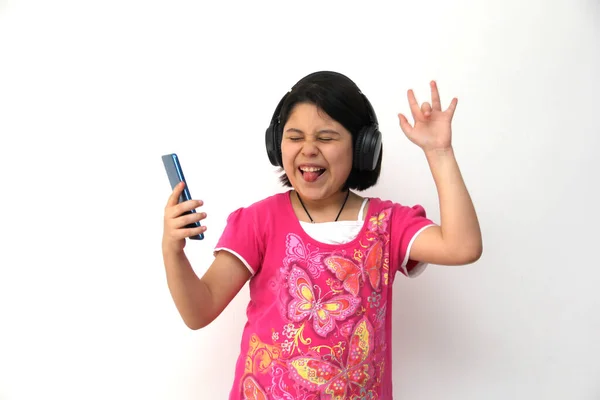 Year Old Hispanic Girl Listens Music Her Headphones Connected Her — Stockfoto