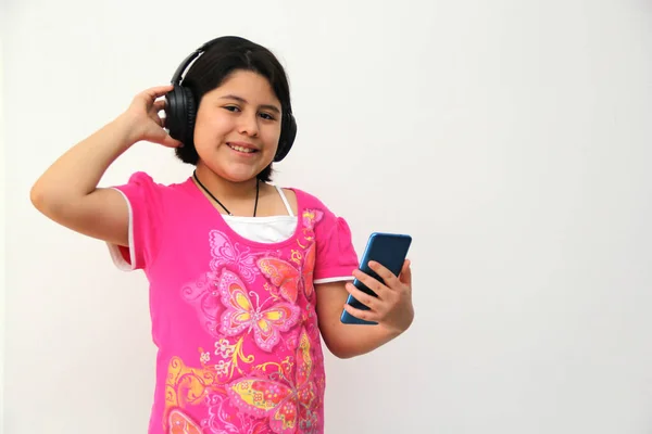 Year Old Hispanic Girl Listens Music Her Headphones Connected Her — Stockfoto