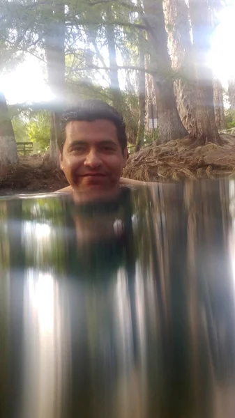 Latino Adult Man Swims Crystal Clear Spring Water Media Luna — Zdjęcie stockowe