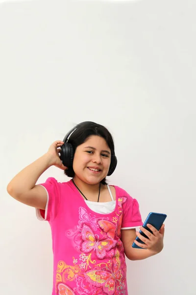 Year Old Hispanic Girl Listens Music Her Headphones Connected Her — Stockfoto