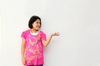 Happy and excited Hispanic 10-year-old girl is amazed at a promotion or discount of something that children like very much