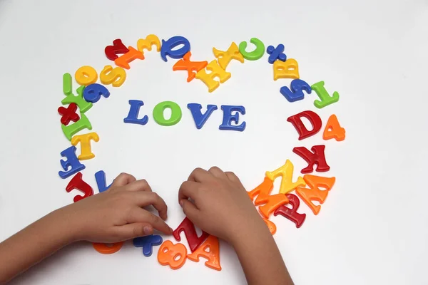Children's game of colored letters form the word 