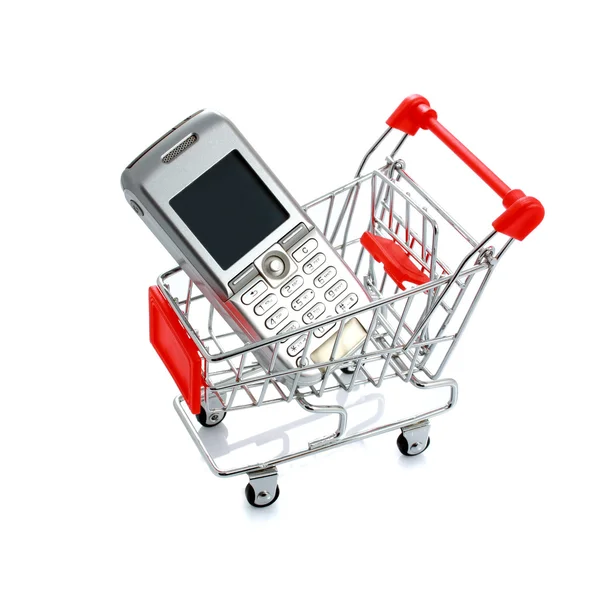 Celular no carrinho de compras isolado no branco — Fotografia de Stock