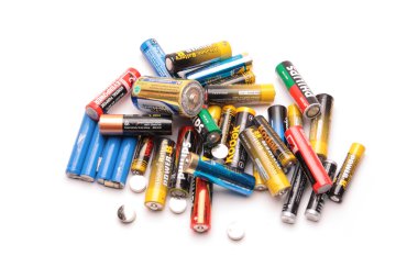 KOCAELI, TURKEY - FEBRUARY 23: Group of old batteries isolated o clipart