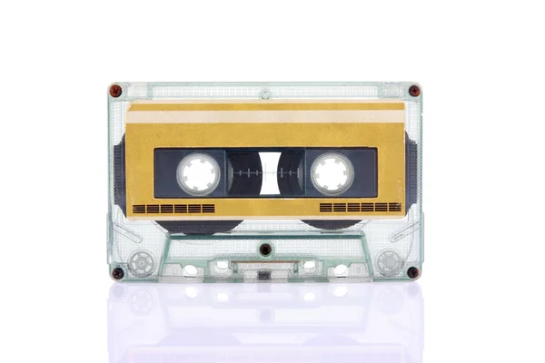 Compact Cassette isolated on white with blank gold color label — Stock Photo, Image