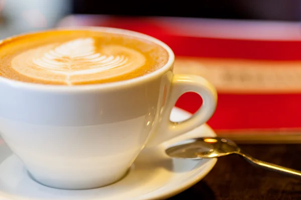 A cup of coffee on the table — Stock Photo, Image