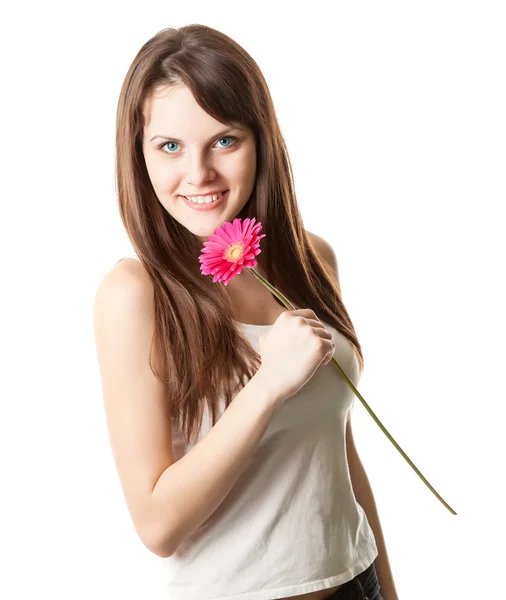 Mooie vrouw met bloem in een studio — Stockfoto