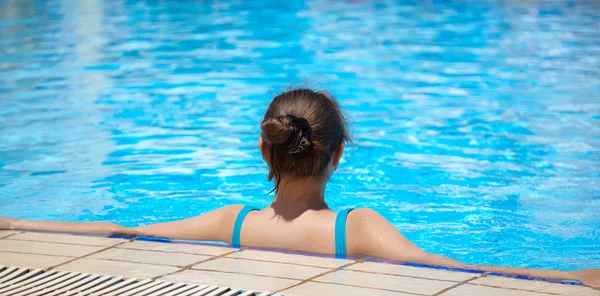 Woman is in the swimming pool Royalty Free Stock Images