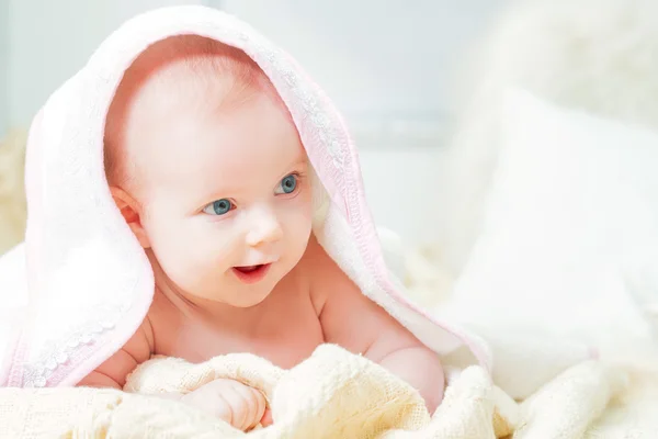 Little baby under rose towel — Stock Photo, Image