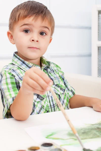 Boy is painting something — Stock Photo, Image