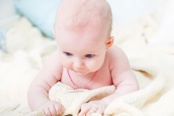 Baby girl in on the bed — Stock Photo, Image