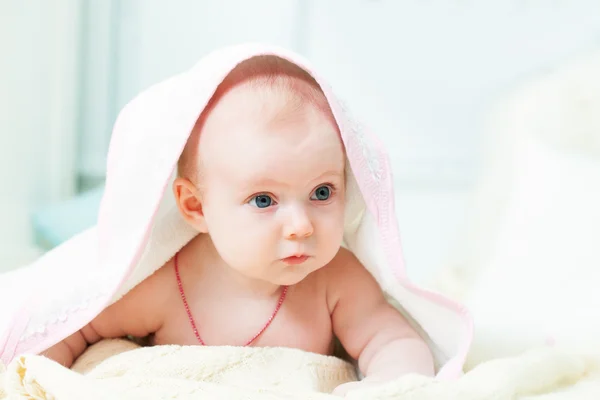 Little baby under rose towel — Stock Photo, Image