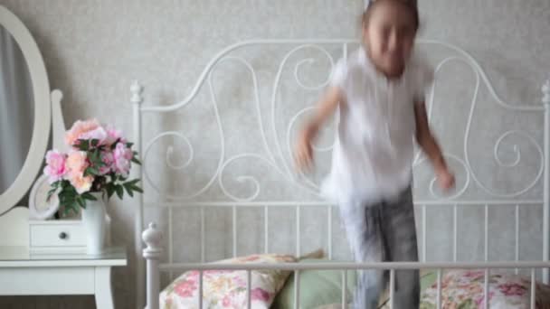 Little girl is jumping on the bed. HD video — Stock Video