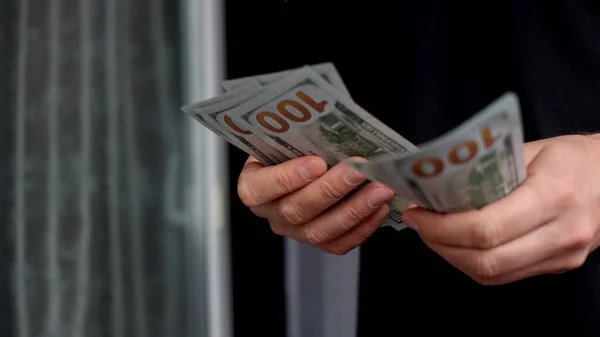 Man counting dollar bills. — Stock Photo, Image