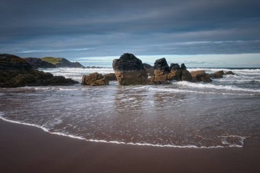 Landscape a beautiful beach with sea cliffs and waves in the north of Scotland. Durness Beach, Scotland