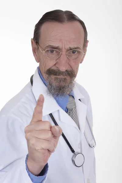 Доктор с поднятым пальцем в предупреждении — стоковое фото