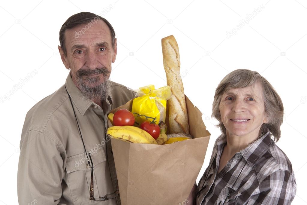 Retired couple with groceries