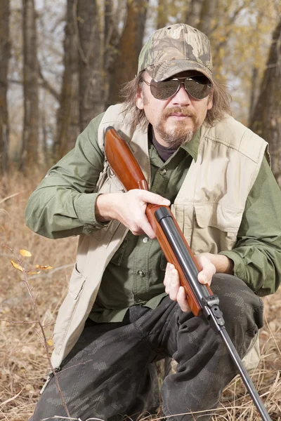 Gunman in the forest — Stock Photo, Image