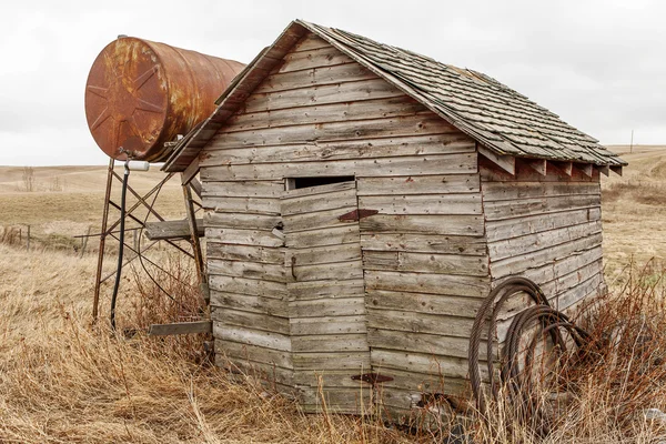 Vintage shack with fuel tank — Stock Photo, Image