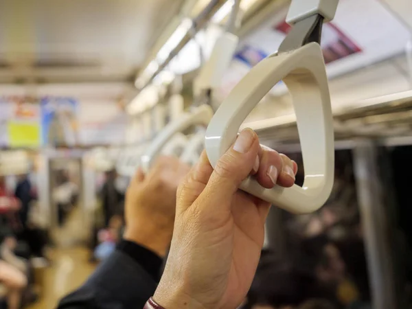 Hands Holding Handles Support Themselves While Standing Busy Subway Train — Stock Photo, Image