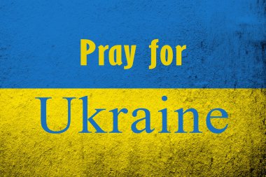 Ukrayna için dua et. Ukrayna bayrağı ve savaş karşıtı bir mesaj. Grunge arkaplanı