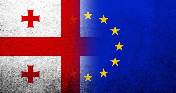 Európai Unió Zászlaja Grúzia Országának Nemzeti Zászlajával Grunge Háttér Stock Kép