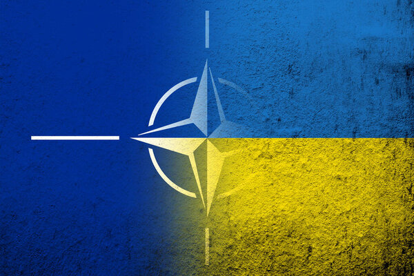 National flag of Ukraine with Flag of North Atlantic Alliance NATO. Grunge background
