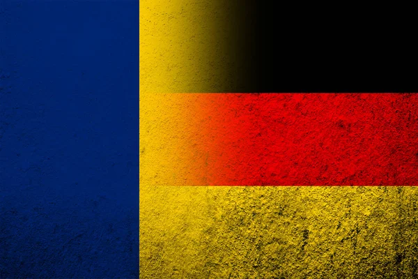 The national flag of Germany with The Republic of Chad National flag. Grunge background