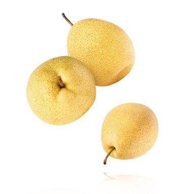Fresh yellow ripe raw pear falling in the air isolated on white background. Food zero gravity conception. High resolution image.