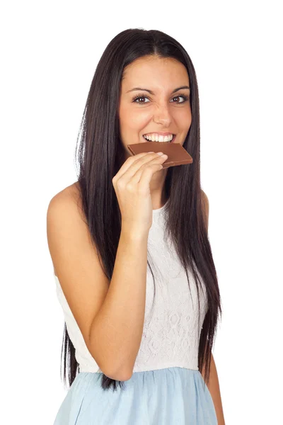 Mladá dívka, pojídání čokolády — Stock fotografie