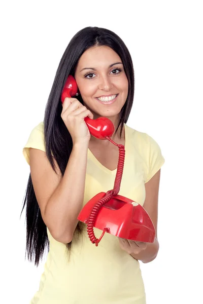 Menina morena atraente chamando com telefone vermelho — Fotografia de Stock