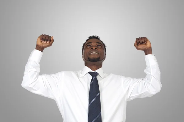 Attractive businessman celebrating a triumph — Stock Photo, Image