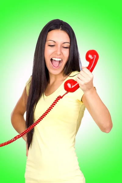 Mulher Casual gritando um telefone vermelho — Fotografia de Stock