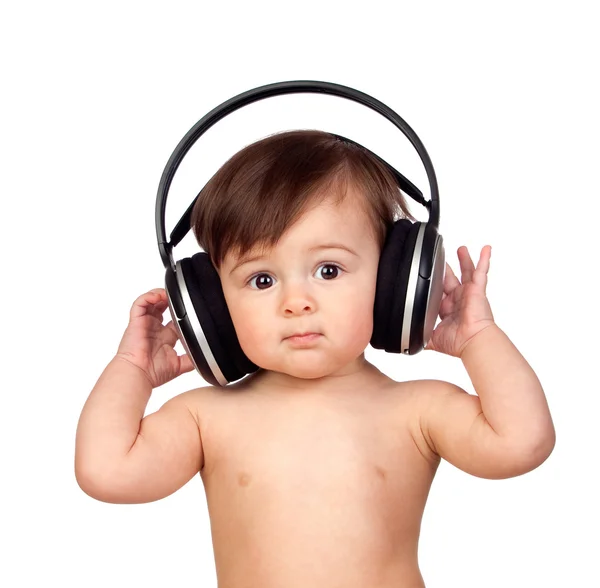 Adorable baby girl with big headphones — Stock Photo, Image