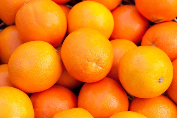 Many oranges stacked — Stock Photo, Image