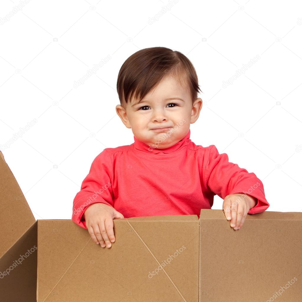 Adorable baby girl in a box